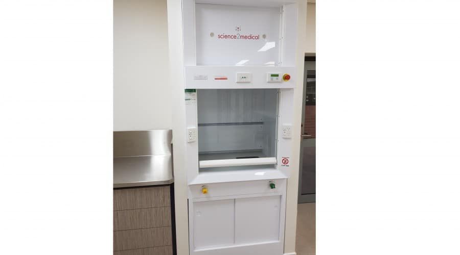 A White Refrigerator Is Sitting in A Room Next to A Stainless Steel Counter — Waltlec Industries In Garbutt, QLD