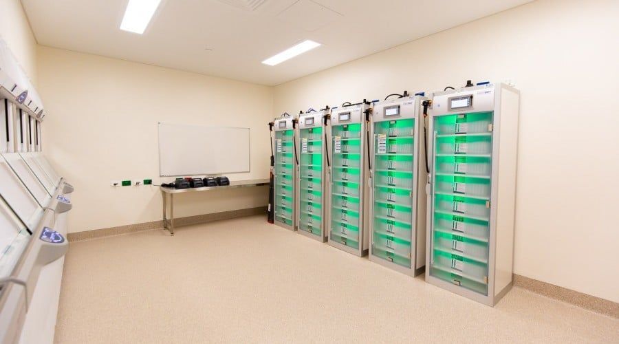 A Room with A Lot of Cabinets with Green Lights on Them — Waltlec Industries In Garbutt, QLD