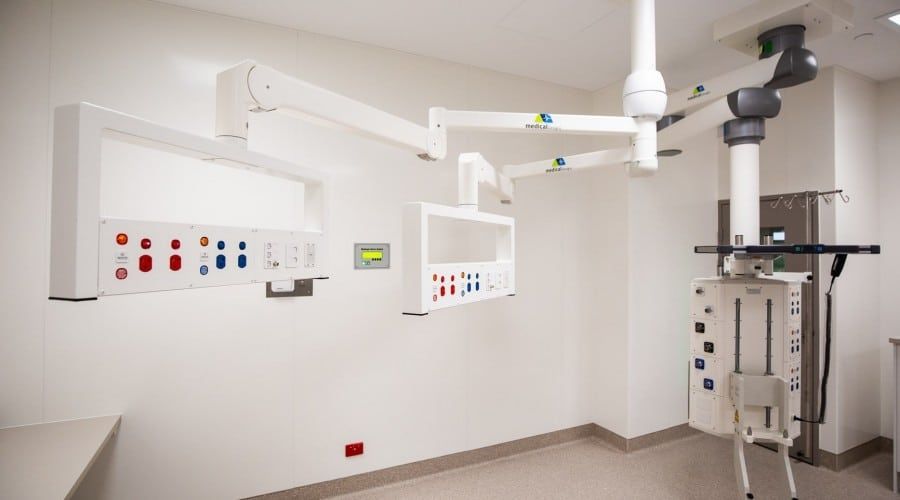 An Empty Operating Room in A Hospital with A Monitor Hanging from The Ceiling — Waltlec Industries In Garbutt, QLD