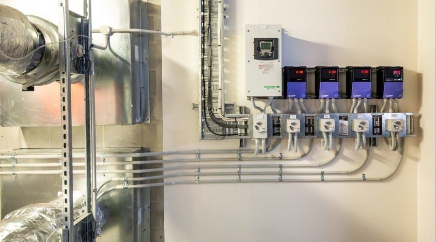 A Bunch of Electrical Wires Are Hanging on A Wall — Waltlec Industries In Garbutt, QLD