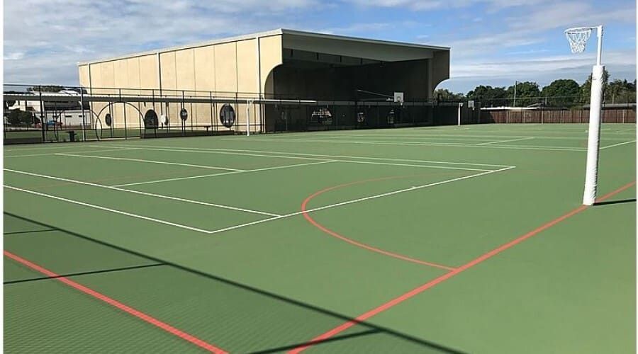 A Basketball Court with A Basketball Hoop in Front of A Building — Waltlec Industries In Garbutt, QLD