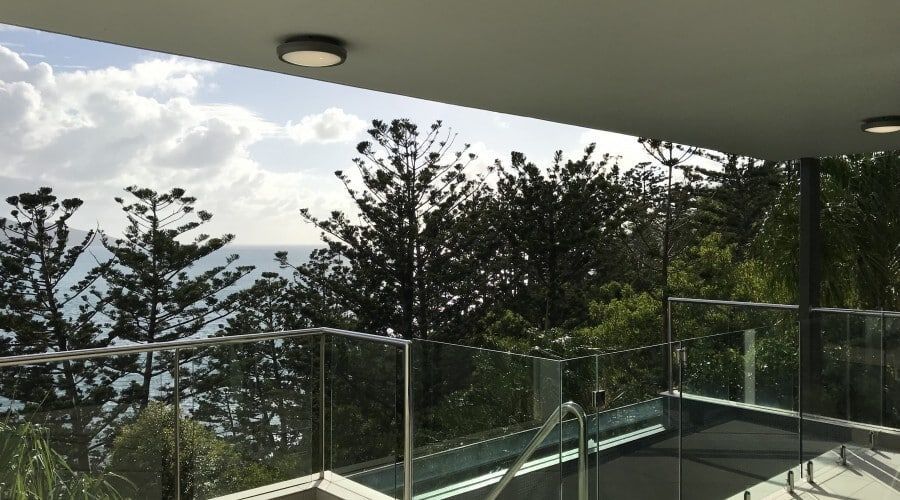 A Balcony with A View of The Ocean and Trees — Waltlec Industries In Garbutt, QLD