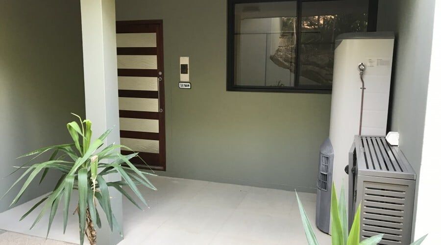 A House with A Heater and A Plant in Front of It — Waltlec Industries In Garbutt, QLD