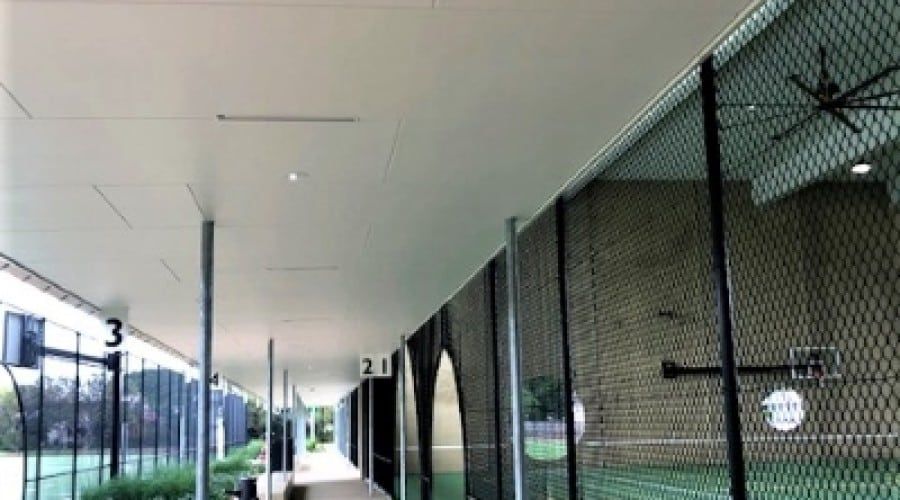 A Long Walkway Between Two Buildings with A Ceiling Fan — Waltlec Industries In Garbutt, QLD