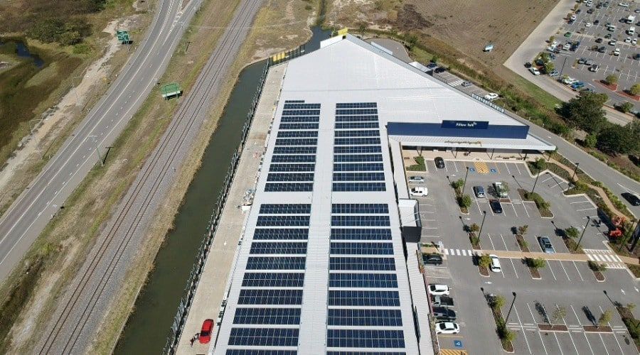 An Aerial View of A Building with Solar Panels on The Roof — Waltlec Industries In Garbutt, QLD