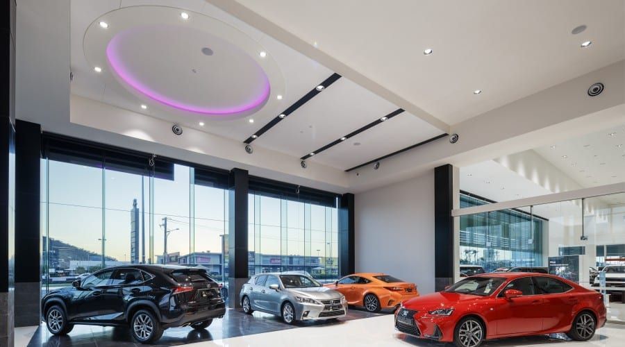 A Showroom Filled with Cars and A Purple Ceiling — Waltlec Industries In Garbutt, QLD