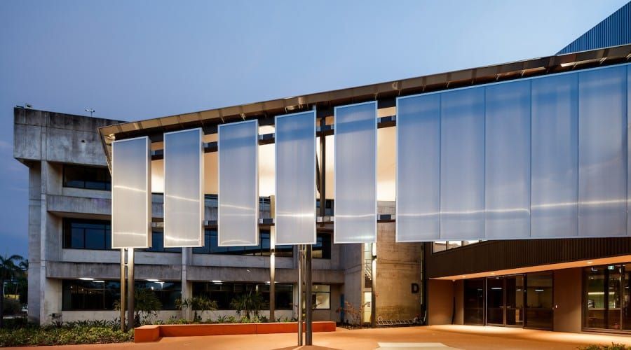 A Large Building with A Lot of Mirrors on The Side of It — Waltlec Industries In Garbutt, QLD