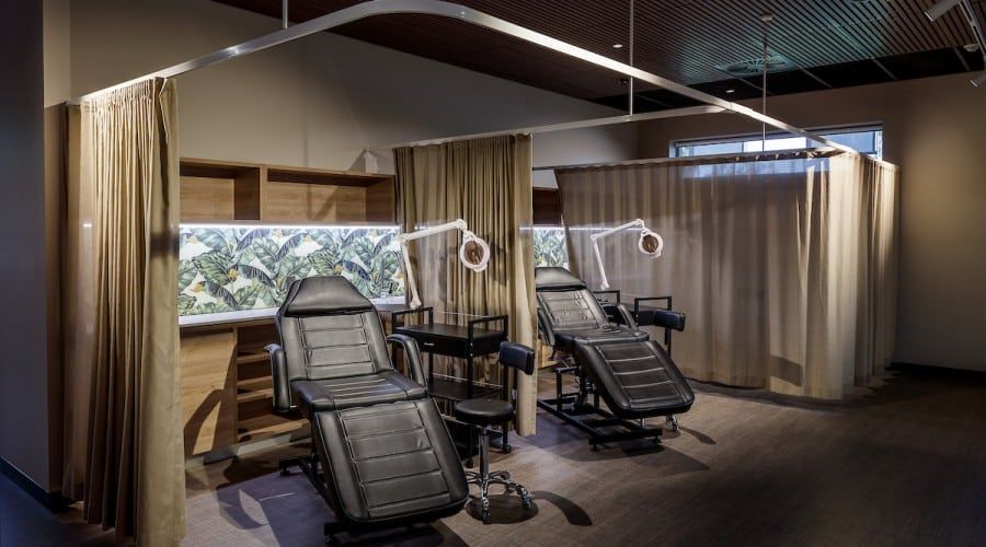 A Room with Two Chairs and Curtains in It — Waltlec Industries In Garbutt, QLD