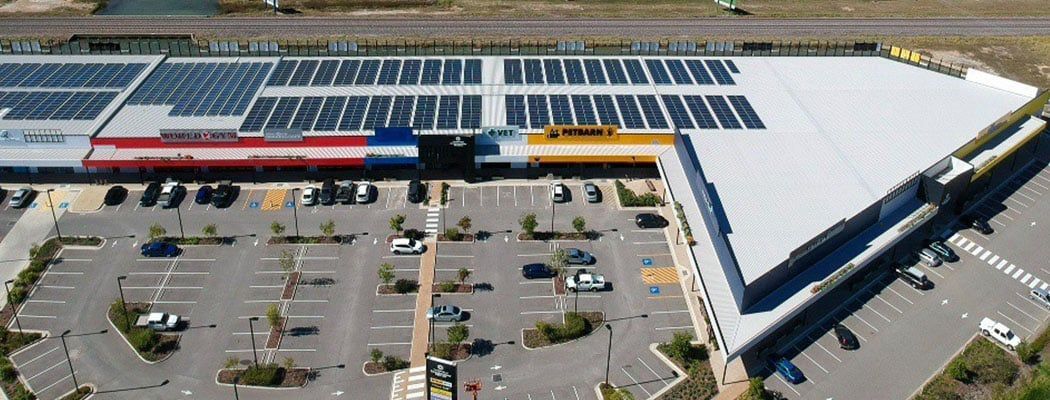 An Aerial View of A Large Building with Solar Panels on The Roof — Waltlec Industries In Garbutt, QLD