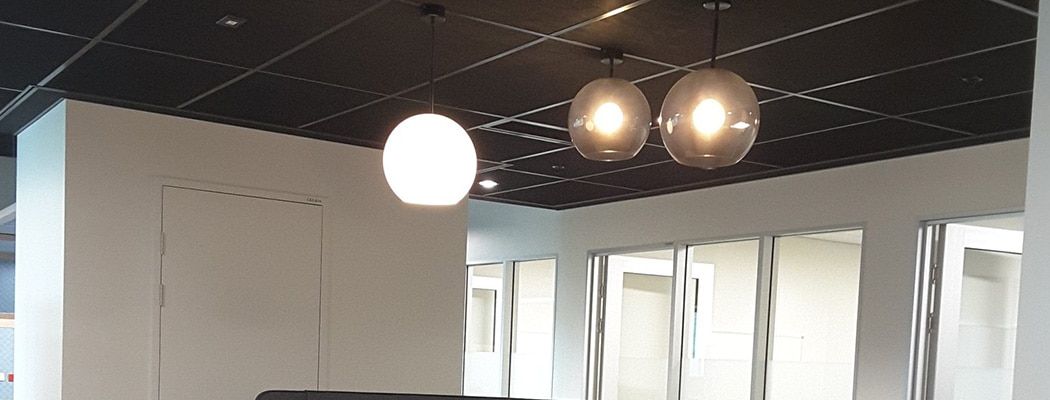 Two Pendant Lights Are Hanging from The Ceiling of A Room — Waltlec Industries In Garbutt, QLD