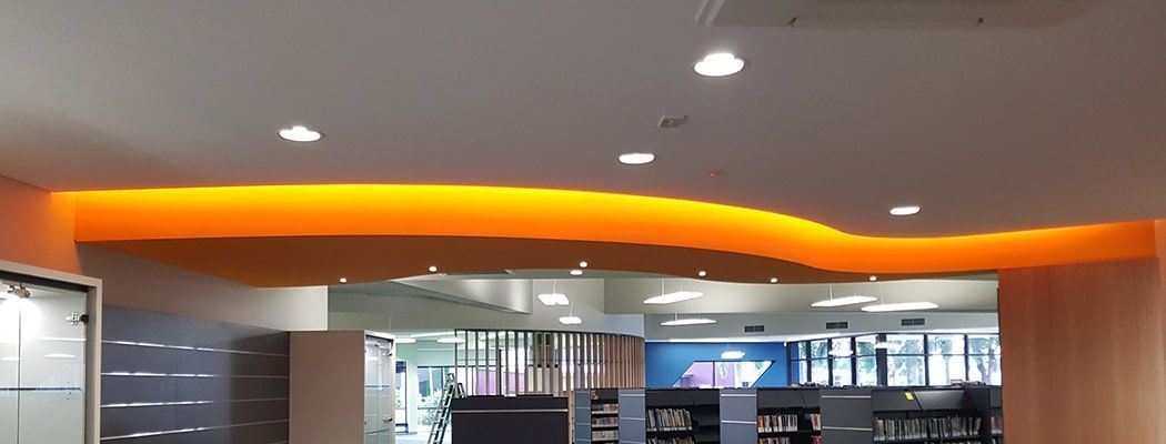 A Room with A Ceiling that Is Orange and Has a Lot of Lights on It — Waltlec Industries In Garbutt, QLD