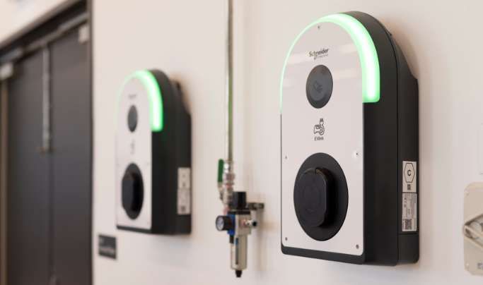 Two Electrical Outlets on A Wall with A Green Light on Them — Waltlec Industries In Garbutt, QLD