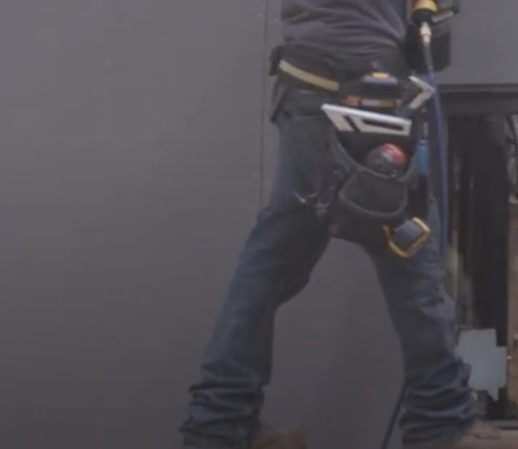 A man installing LP Siding.