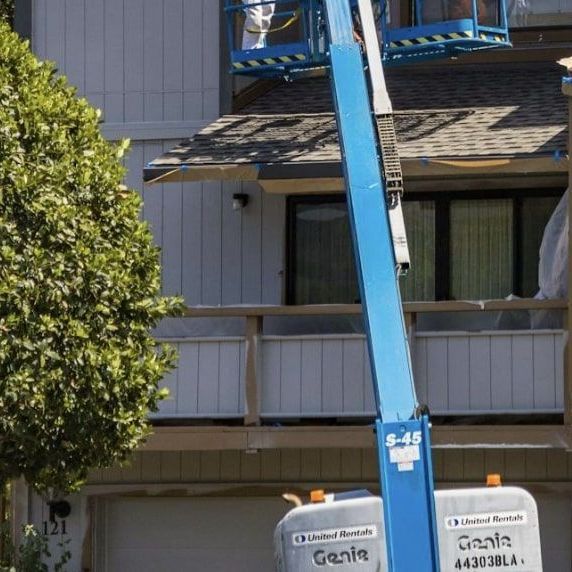 A genie lift is being used to replace a sifing