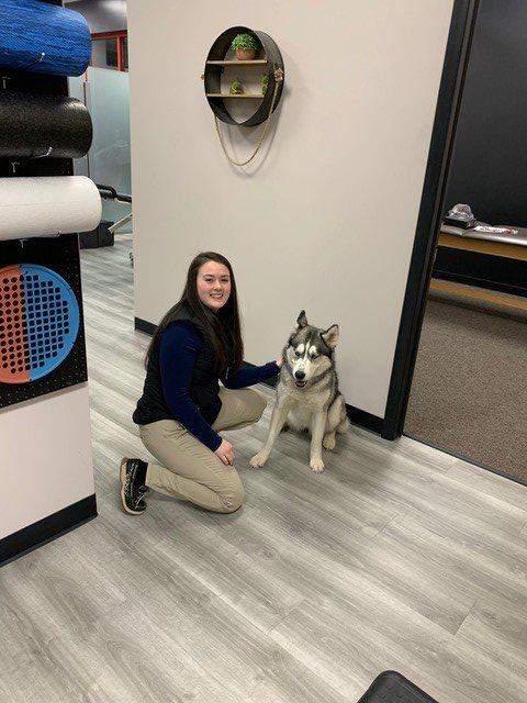 Woman and Dog at Pocono Chiropractic Office — Hawley, PA — Pocono Chiropractic Clinic