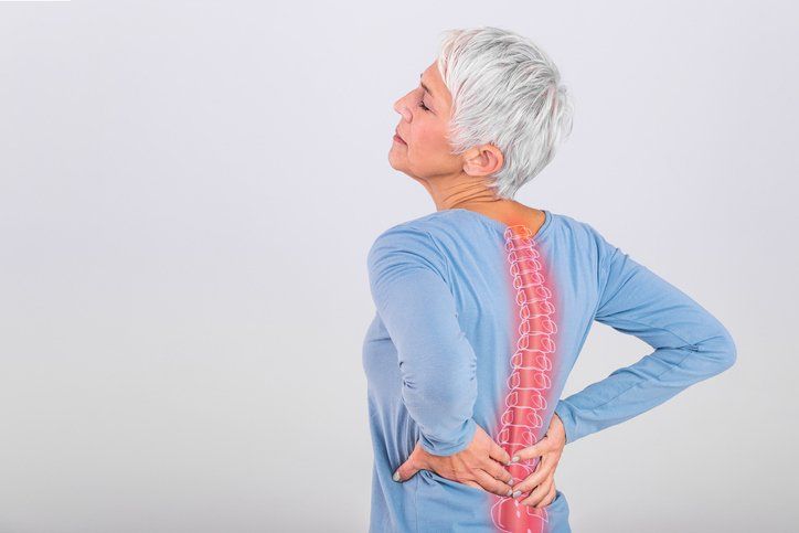 Woman Suffering from Lower Back Pain — Hawley, PA — Pocono Chiropractic Clinic
