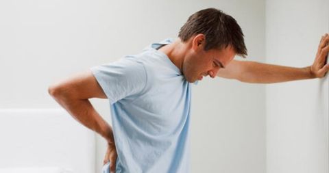 Man Holding His Back — Hawley, PA — Pocono Chiropractic Clinic