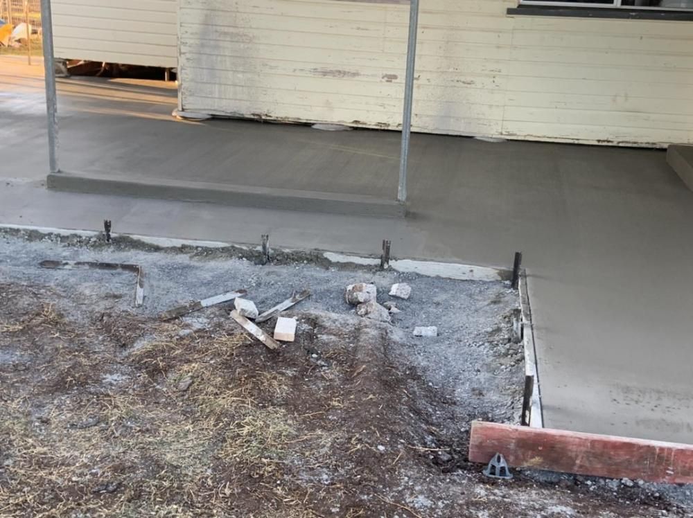 New Concrete Walkway Near Wall — Pedro's Concreting in Pittsworth, QLD