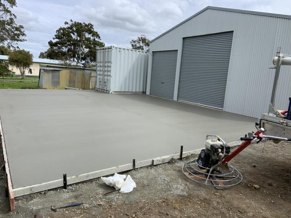 Concrete Driveway is Being Built in Front of a Garage — Pedro's Concreting in Pittsworth, QLD