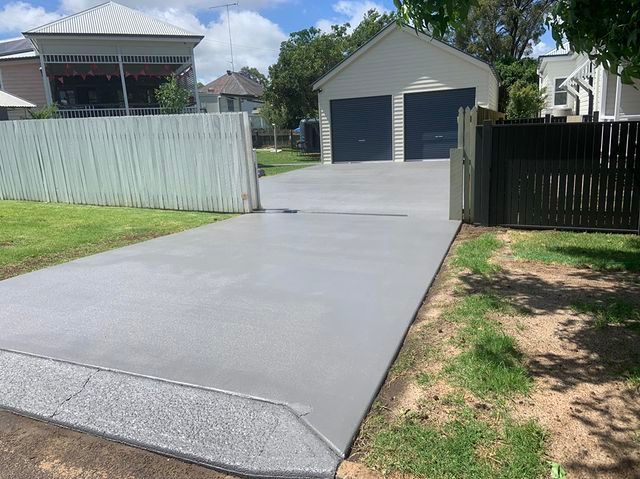 New Concrete Driveway Leading to the Two Door Garage — Pedro's Concreting in Pittsworth, QLD