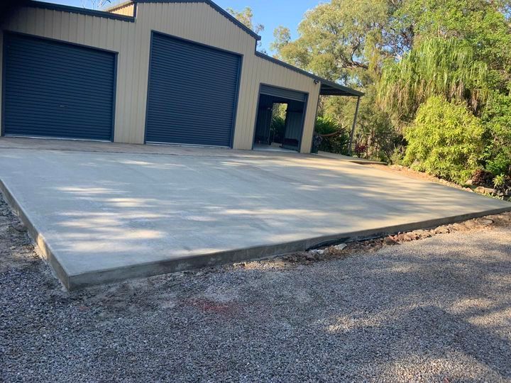 There Is a Concrete Driveway in Front of A Garage — Pedro's Concreting in Warwick, QLD