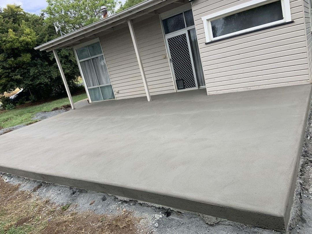 A Concrete Patio Is Being Built in Front of A House — Pedro's Concreting in Warwick, QLD