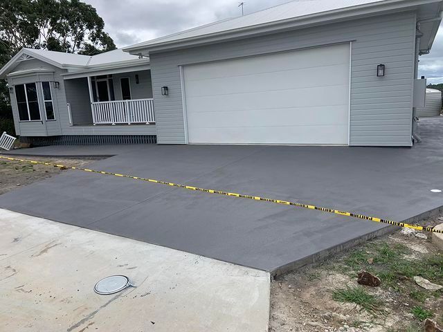 Concrete Driveway Blocked by a Caution Tape — Pedro's Concreting in Warwick, QLD