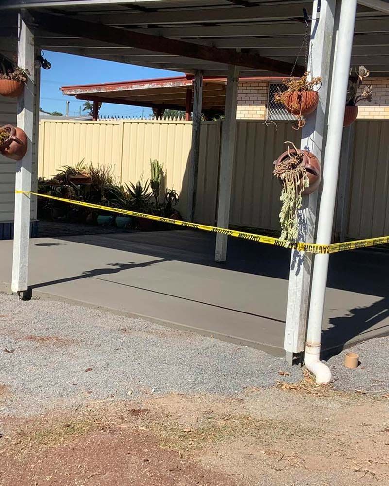 New Concrete Slab Protected by Caution Tape — Pedro's Concreting in Pittsworth, QLD