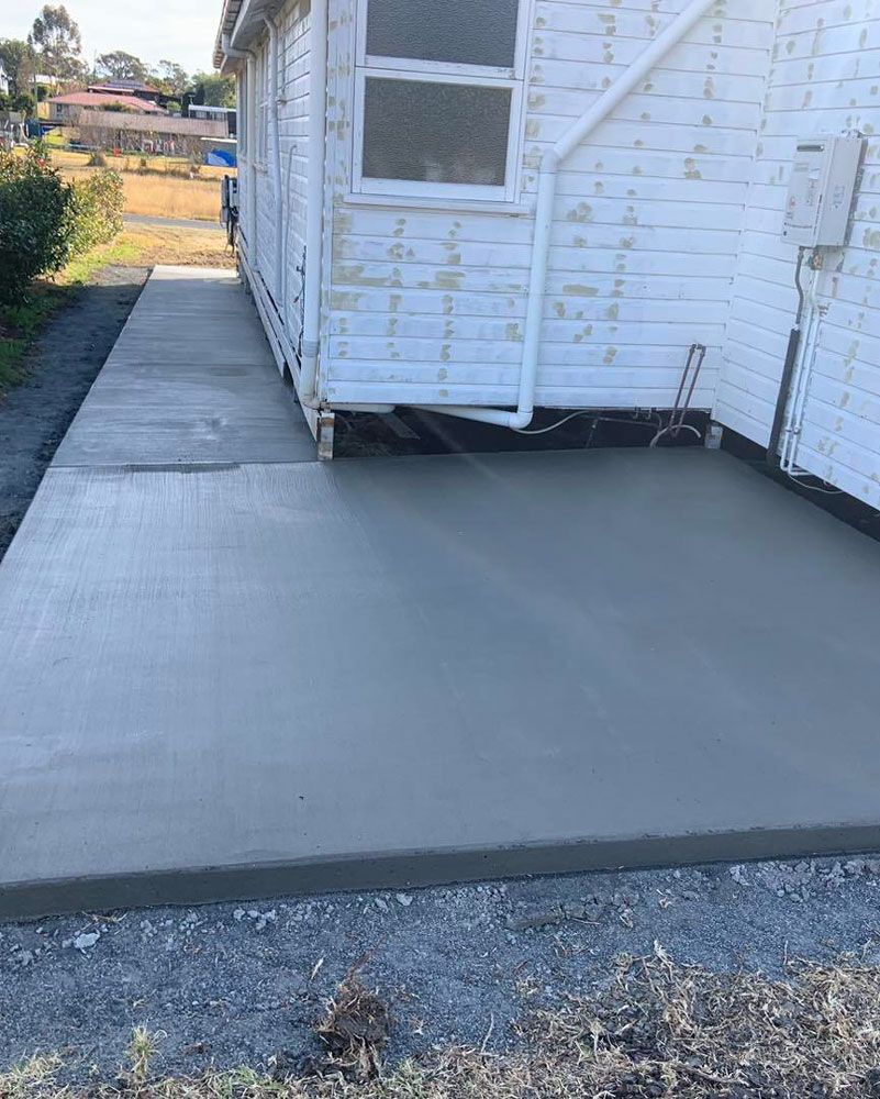 Concrete Walkway Being Built in Front of a White House — Pedro's Concreting in Pittsworth, QLD