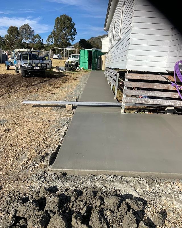 A Concrete Walkway is Being Built in Front of a House — Pedro's Concreting in Pittsworth, QLD
