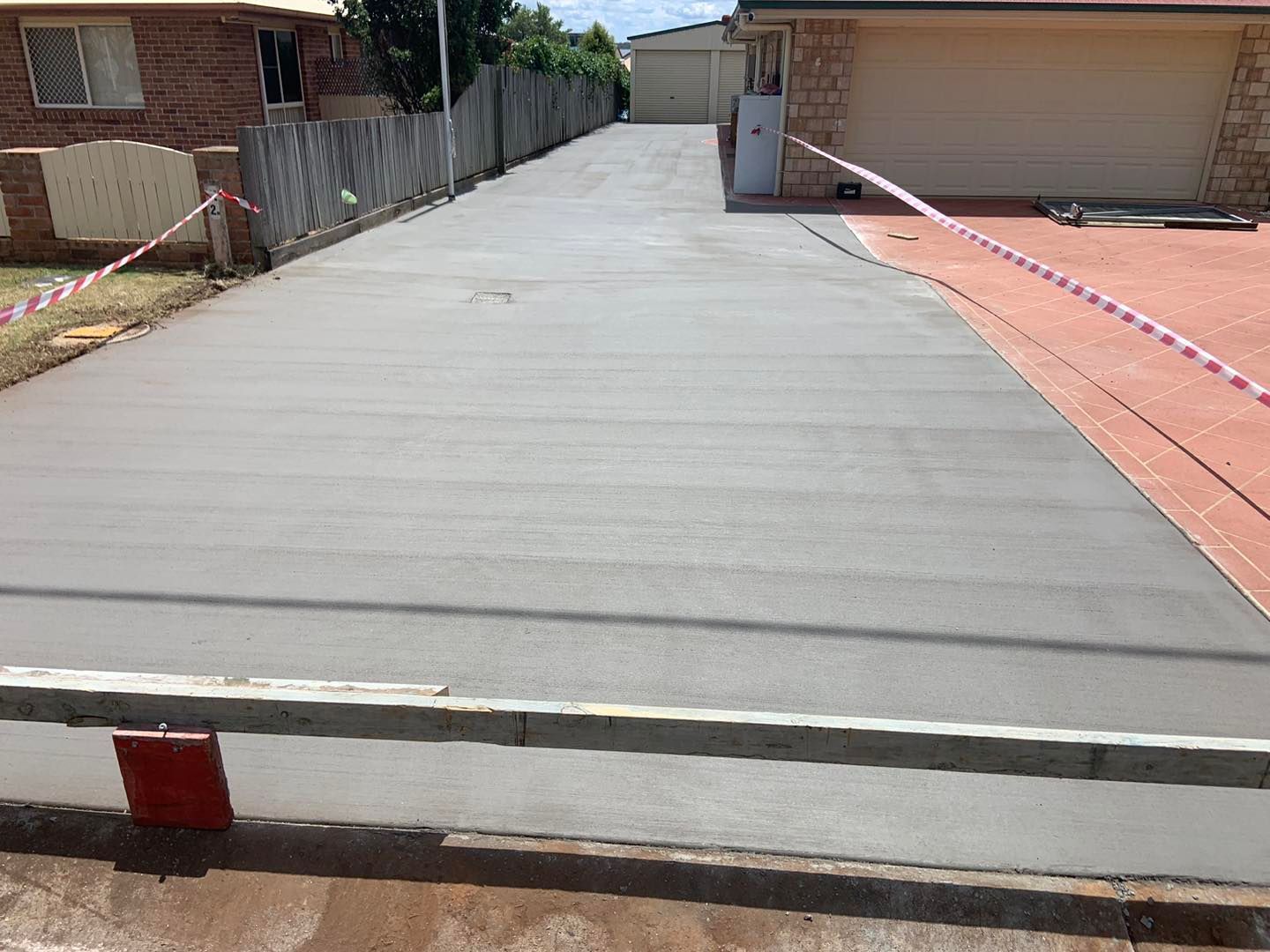 A Concrete Driveway is Being Built in Front of a House — Pedro's Concreting in Pittsworth, QLD