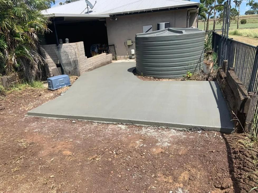 A Large Concrete Slab Is Sitting in The Middle of A Field — Pedro's Concreting in Pittsworth, QLD