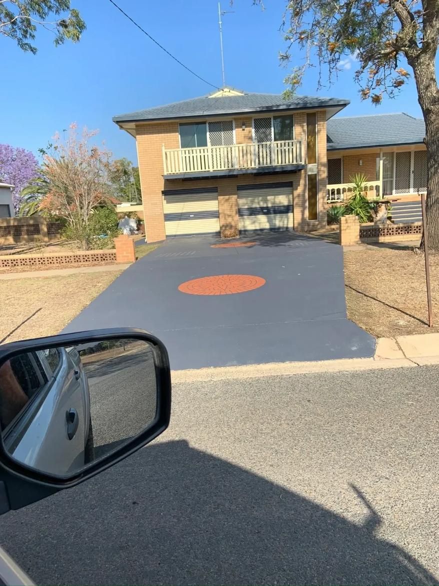A Car Is Parked in Front of A Large House — Pedro's Concreting in Pittsworth, QLD