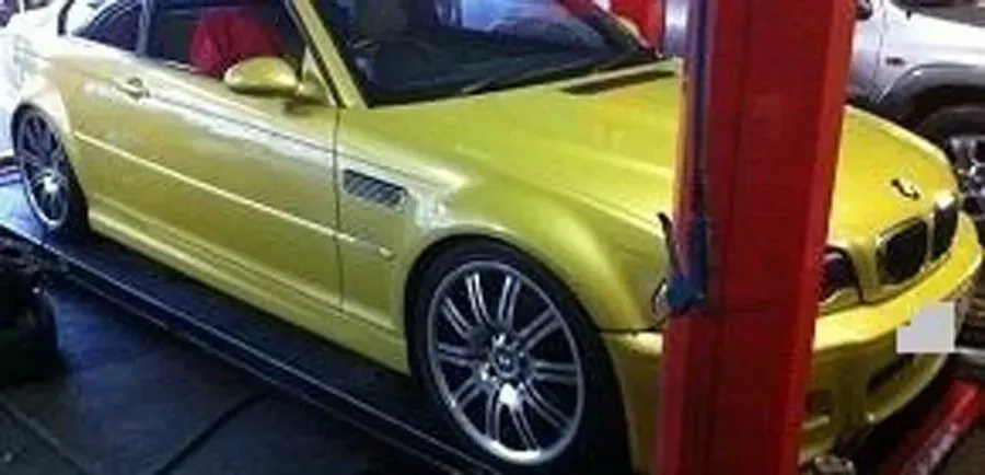 Car ready to be serviced in a mechanic garage — Kirra Mechanical in Coolangatta, QLD