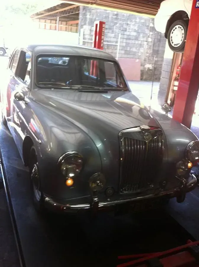 Old car ready to be serviced in a mechanic shop — Kirra Mechanical in Coolangatta, QLD