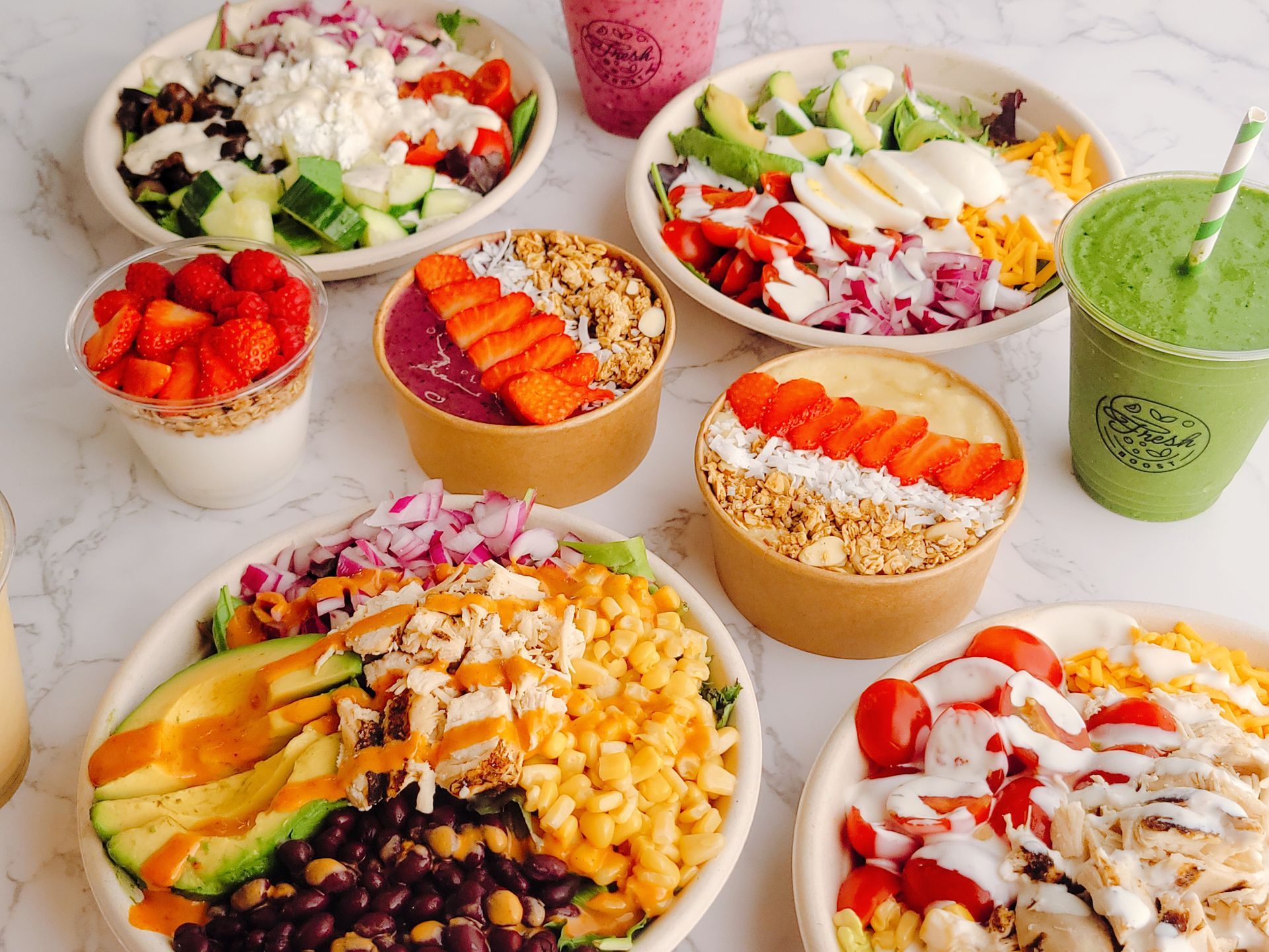 A table topped with bowls of food and drinks.