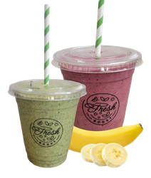 Two cups of smoothies with straws next to a banana