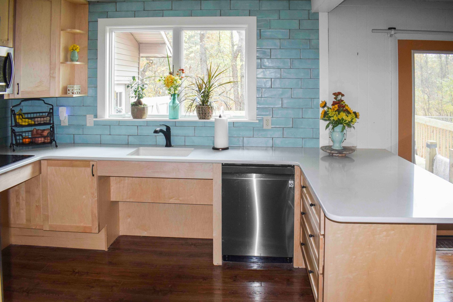 A kitchen with a custom wheelchair-accessible sink and oven.