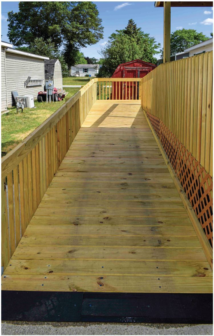 a wooden ramp leading to a home.