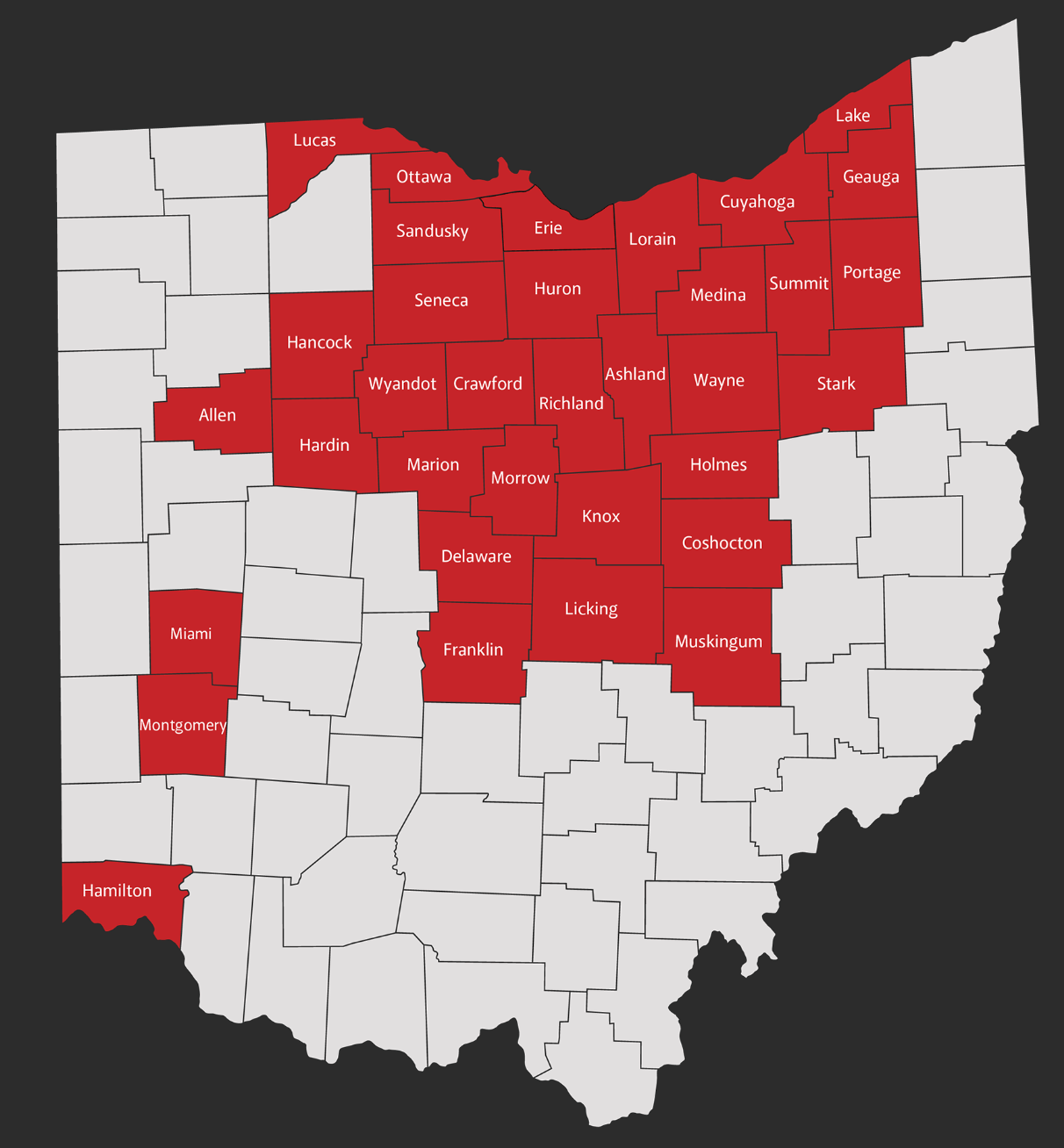 A river flowing through a valley surrounded by mountains and trees.