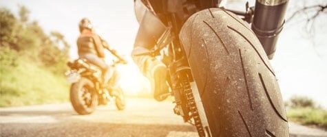 Motorcycle racing on bright sun - Insurance service in Pueblo, Co