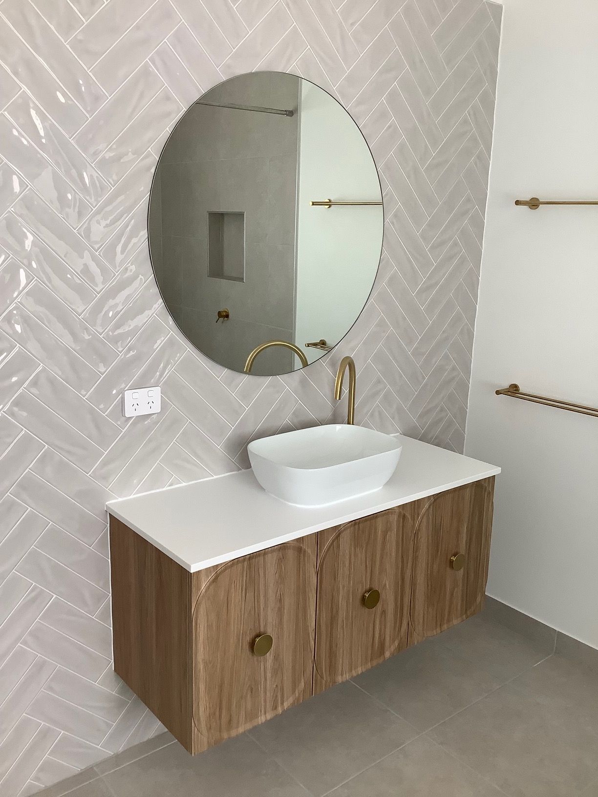 A Bathroom With A Sink And A Mirror — Darryl Tickle Building Pty Ltd In Alice River, QLD