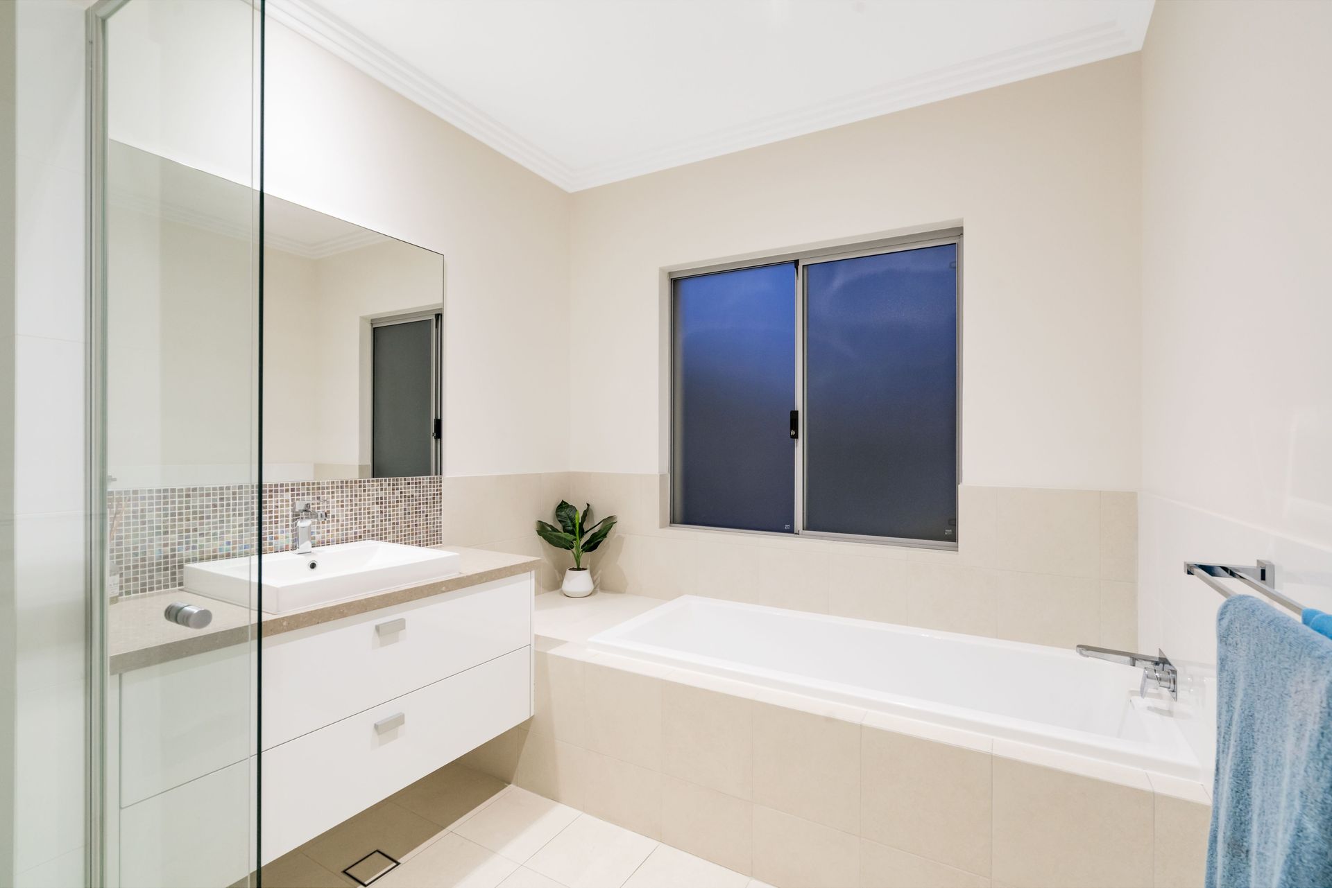 Bathroom With White Bathtub, Vanity, and Window — Country To Coast Building Contractors In Nambour, QLD