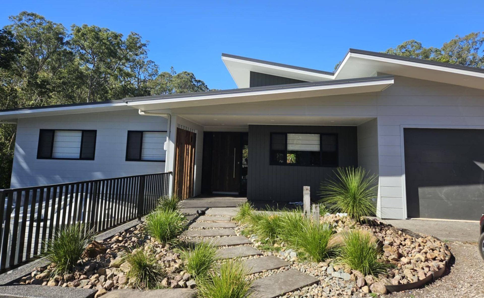 A modern house with a walkway leading to it — Country To Coast Building Contractors In Landsborough, QLD