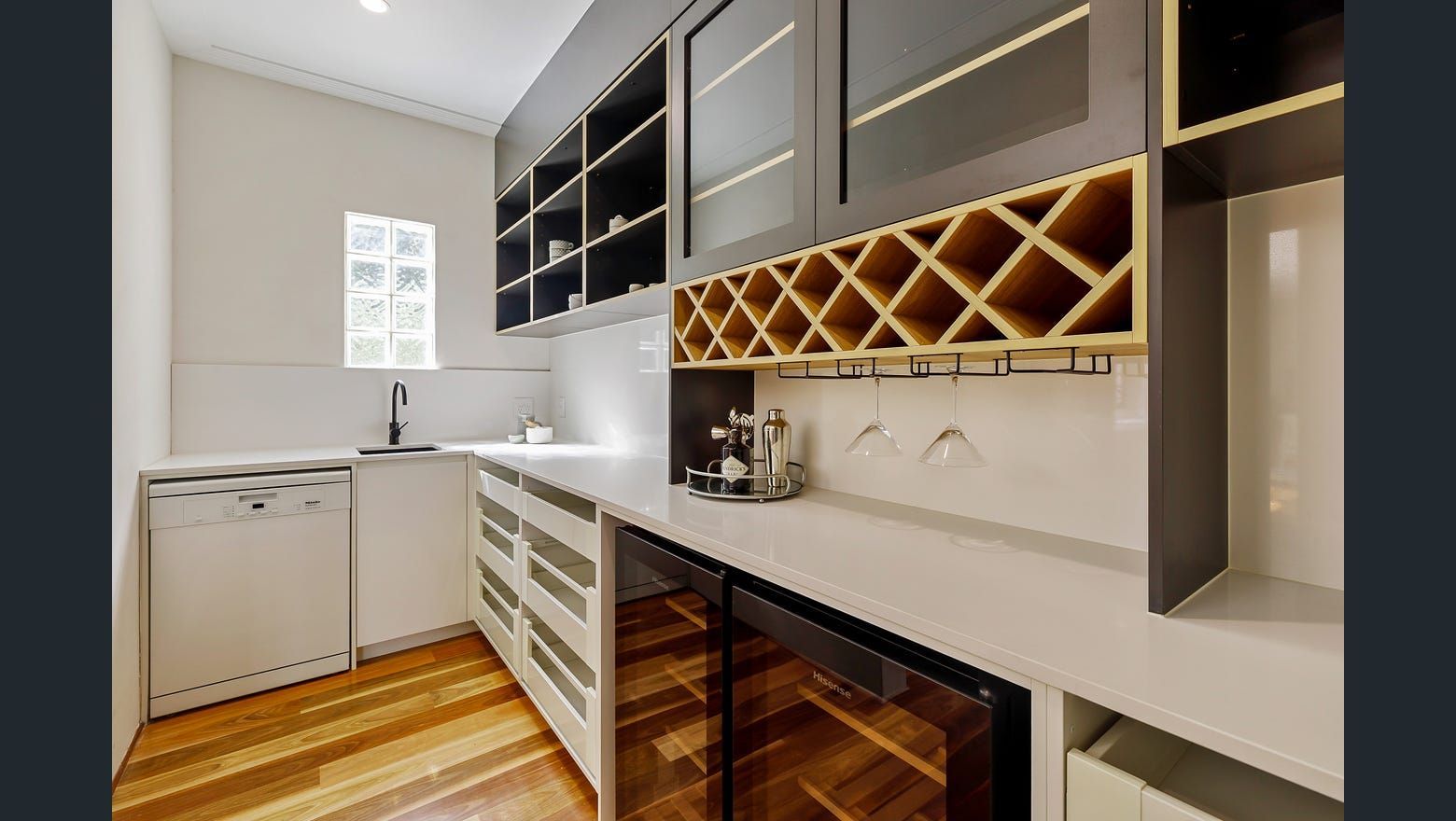 A Kitchen With A Wine Cooler And A Wine Rack — Country To Coast Building Contractors In Landsborough, QLD