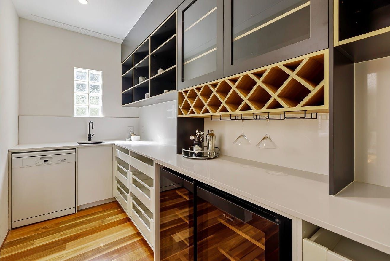 A Kitchen With A Wine Cooler And A Wine Rack — Country To Coast Building Contractors In Landsborough, QLD