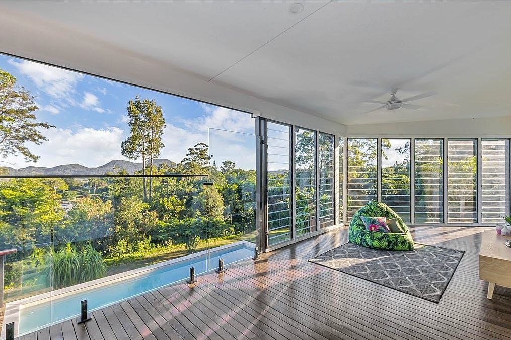 A Living Room With A Large Window — Country To Coast Building Contractors In Landsborough, QLD