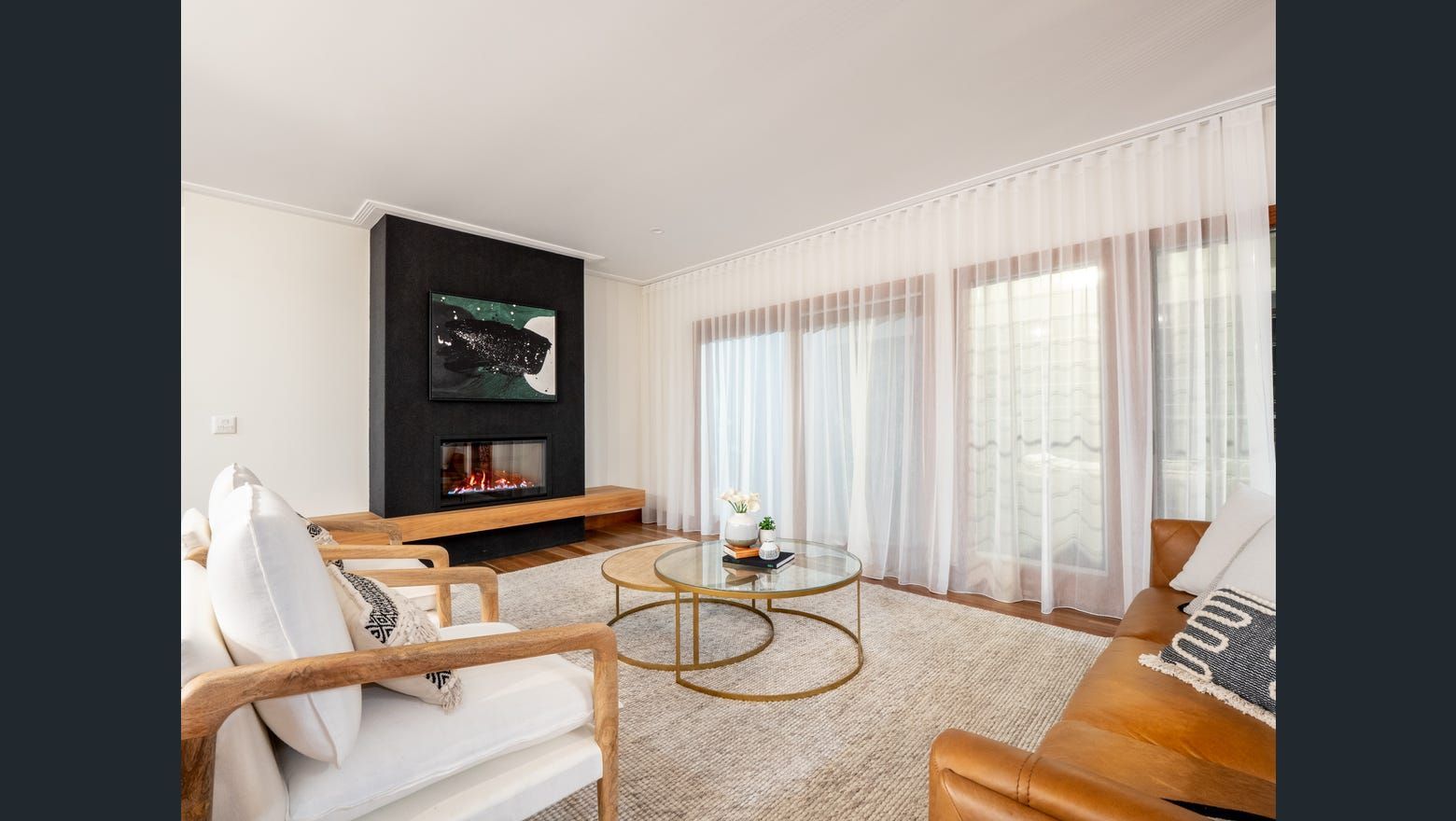 A Living Room With A Couch And Television — Country To Coast Building Contractors In Maroochydore, QLD