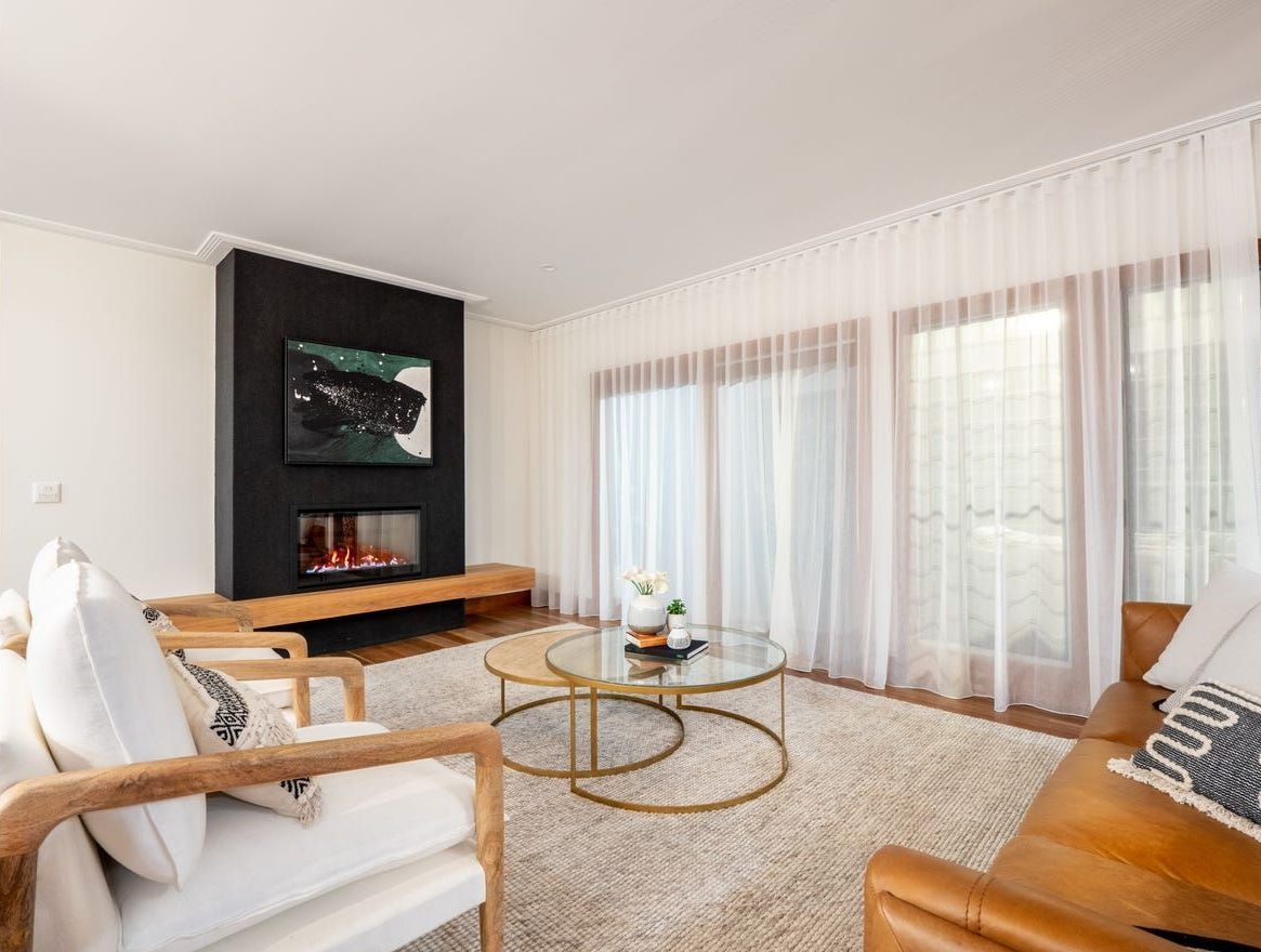 A Living Room With A Couch And Coffee Table — Country To Coast Building Contractors In Landsborough, QLD