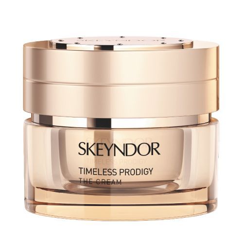 una botella de skeyndor timeless prodigy la crema sobre un fondo blanco.